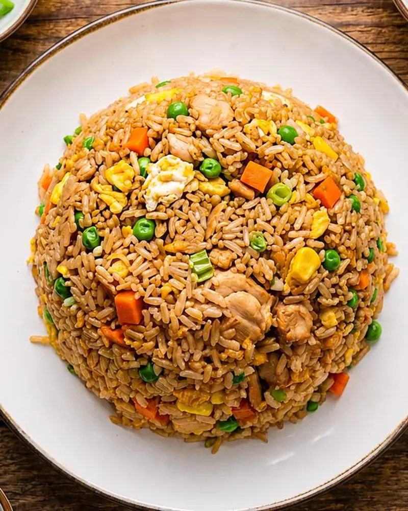Chinese-style fried rice with egg, peas and carrot